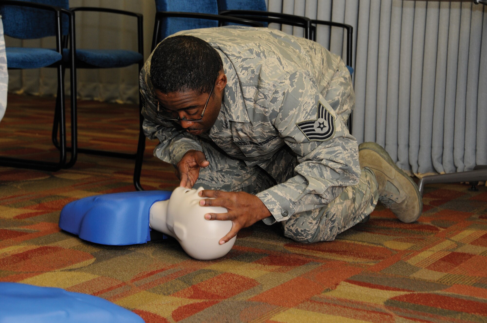 Tech. Sgt. Eddie Norton, 442nd Services Flight technician, practices CPR on a mannequin for annual training, provided by the medical group, during the Feburary unit training assembly. The 442nd Services Flight is part of the 442nd Fighter Wing, an Air Force Reserve unit at Whiteman Air Force Base, Mo. (U.S. Air Force photo/Staff Sgt. Tom Talbert)