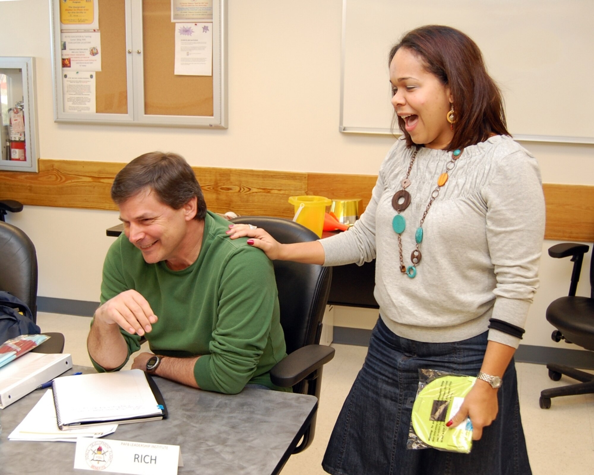 In a class exercise on recognition and praise, Ms. Cartama Ramos-Crafton gives a big dose of compliments to classmate Mr. Rich Greisamer. Both are attending the 45th Force Support Squadron’s Leadership Institute – a civilian leadership development
course administered by the Force Development Flight and geared toward Patrick’s mid-level civilians. The course is the only one of its kind in the U.S. Air Force. (U.S. Air Force photo/Chris Kraus)