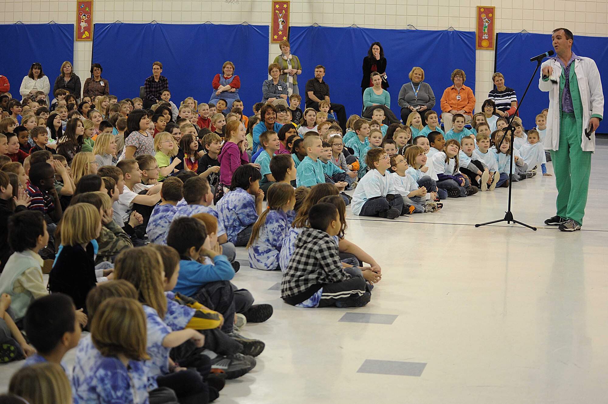 (Right) Capt. Bradley Harrelson, 28th Medical Operations Squadron dentist, also known as Dr. Juggles, explains to children the importance of dental health and oral hygiene at Francis Case School, Box Elder, S.D., Feb. 17. Dr. Juggles visited several local schools to promote National Children's Dental health month, which is observed every February by the American Dental Association. (U.S. Air Force photo/Airman 1st Class Corey Hook)