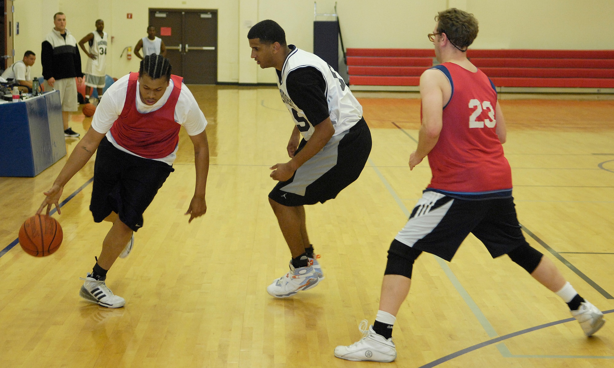 VANDENBERG AIR FORCE BASE, Calif. -- Frank Coleman, from the Old Guys team, attempts to dribble past his opponent and a potential screen on his way to the hoop during an intramural basketball game here Tuesday, Feb. 23, 2010. The 30th Security Forces Squadron team fought hard, winning 53-38 over the Old Guys team.  (U.S. Air Force photo/Airman 1st Class Andrew Lee) 

 

 
 