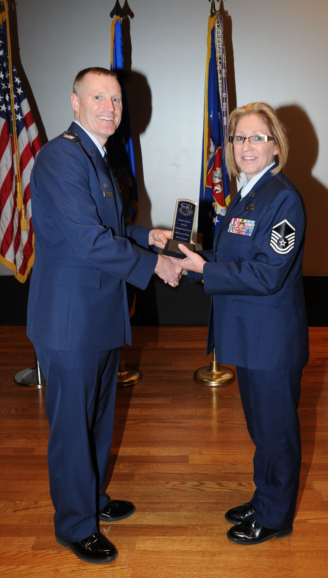 Master Sgt. Susie Blocker receives the Senior Noncommissioned Officer of the Year Award at the 927th Air Refueling Wing quarterly commander's call Feb. 21. Blocker is the Program Manager for Career Development with the 927th Mission Support Flight. (U.S. Air Force photo/Tech. Sgt. Denise Hauser)