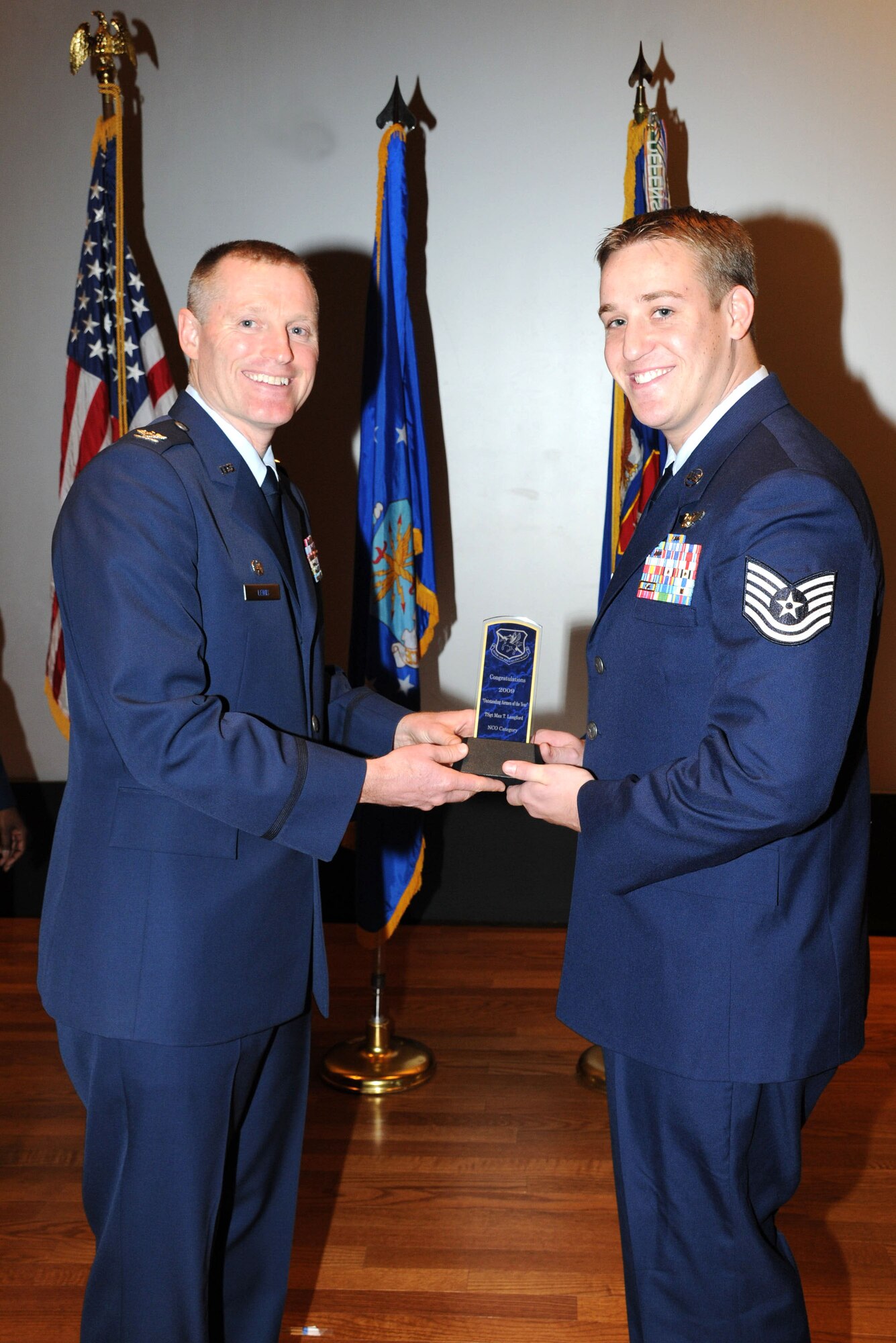Tech Sgt. Max Langford receives the Noncommissioned Officer of the Year Award at the 927th Air Refueling Wing quarterly commander's call Feb. 21 Langford is a boom operator with the 927th Operations Group. (U.S. Air Force photo/Tech. Sgt. Denise Hauser)