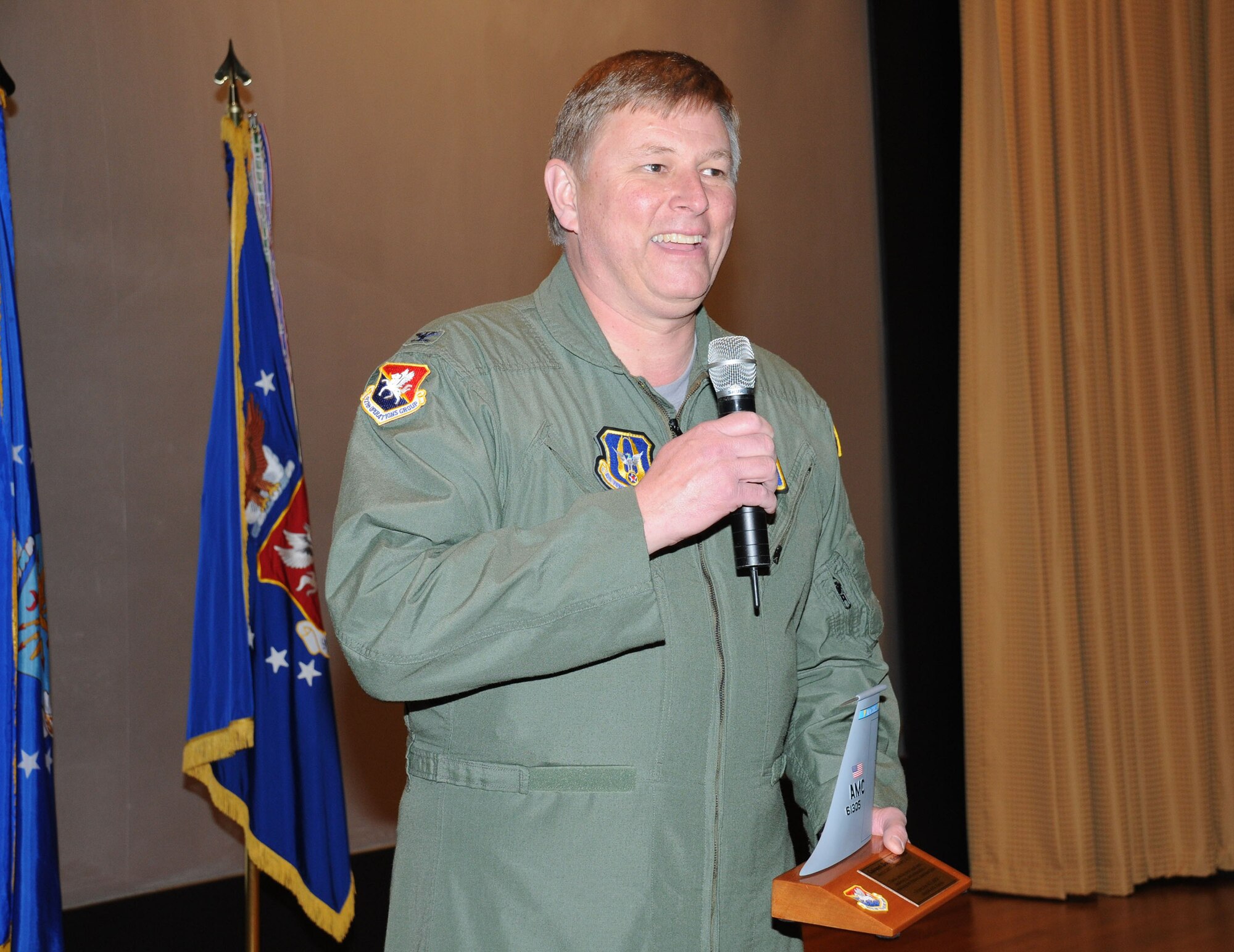 Col. Doug Schwartz, 927th Operations Group Commander bids farewell to the 927th Air Refueling at the quarterly commander's call Feb 21.  Schwartz is relocating to Scott Air Force Base.  (U.S. Air Force photo/Tech. Sgt. Denise Hauser)
