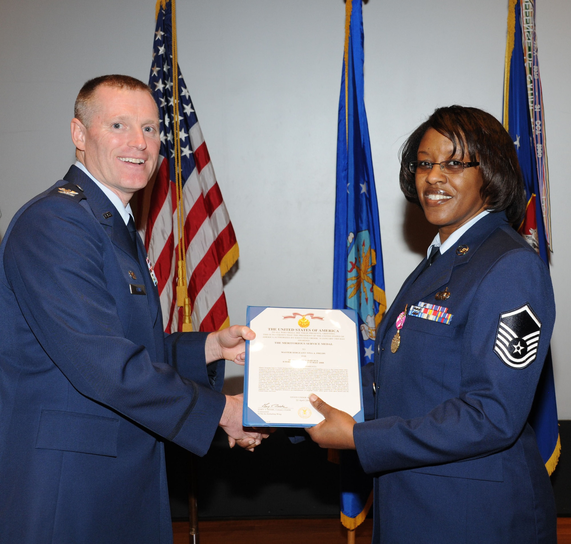 Master Sgt. Tina Fields is awarded the Meritorious Service Medal at the 927th Air Refueling quarterly commander's call Feb 21.  Fields is a Logistics Plans Specialist with the 927th Logistics Readiness Squadron.  (U.S. Air Force photo/Tech. Sgt. Denise Hauser)