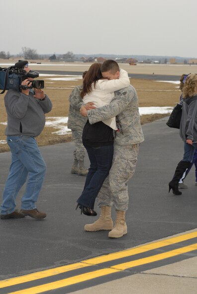 Family members and personnel from the126th Air Refueling Wing’s Security Forces Squadron, Illinois Air National Guard, Scott Air Force Base, Ill., embrace Feb 12 after returning home from a six month mobilization in support of Operation Iraqi Freedom. (U.S. Air Force photo by Staff Sgt. Johnathon Orrell)