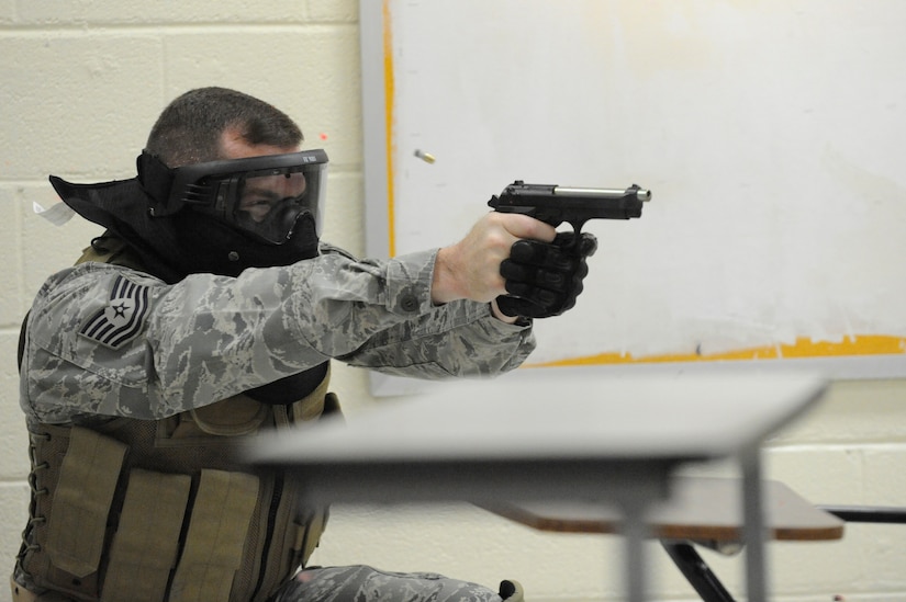 U.S. Air Force Tech. Sgt. Chad Murphy opens fire on a perpetrator during a clearing room exercise while attending the Active Shooter Training Course in Mt. Pleasant, S.C., Feb. 23, 2010. The AST course prepares first responders on how to react to a hostile situation.  Sergeant Murphy is the Non-Commissioned Officer in Charge of Operations with the 628th Security Forces Squadron. (U.S. Air Force photo by James M. Bowman/released)

