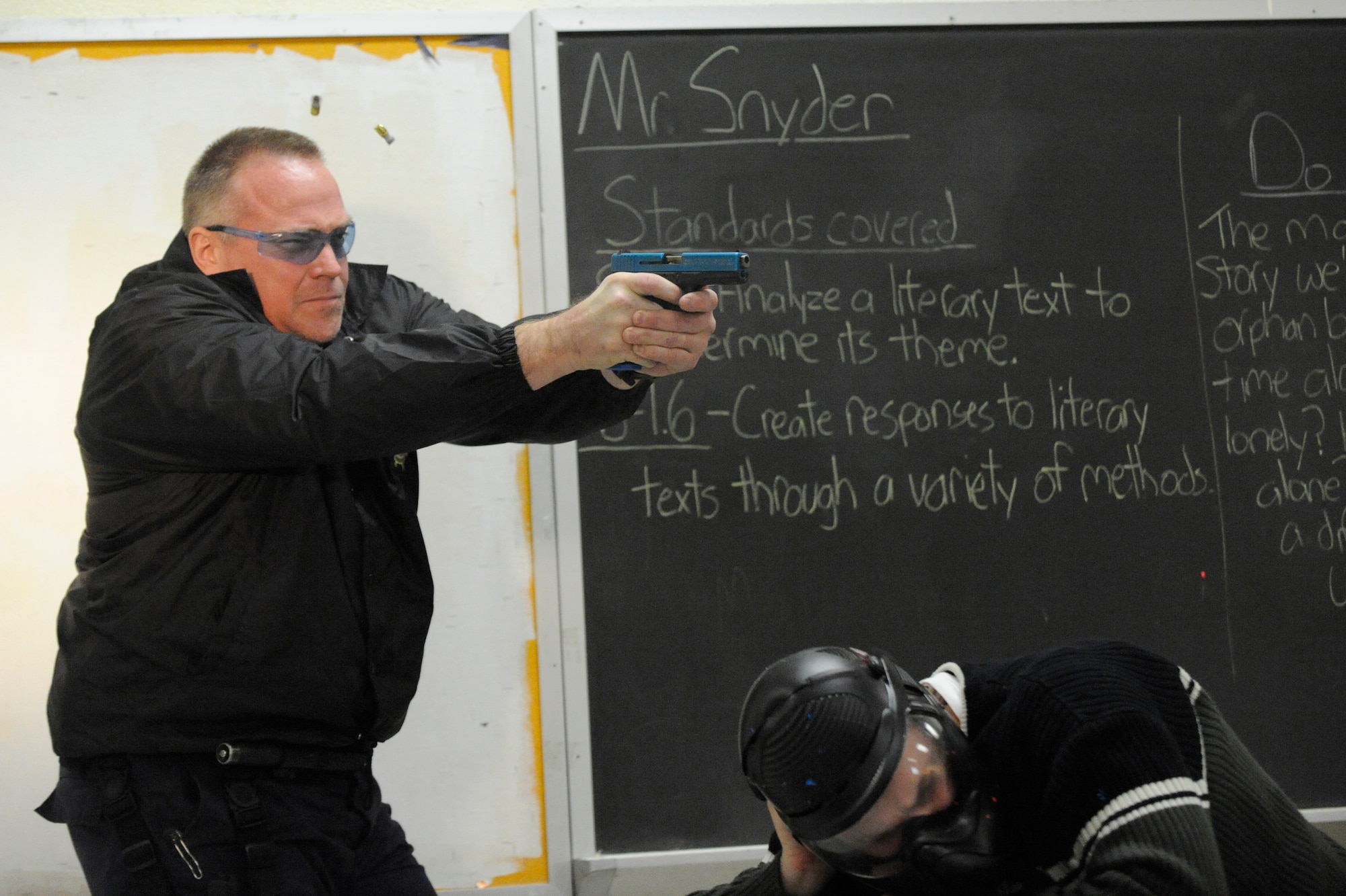 Don Kjellman opens fire on an perpetrator during a clearing room exercise while attending the Active Shooter Training Course in Mt. Pleasant, S.C., Feb. 23, 2010. The AST course prepares first responders on how to react to a hostile situation. Mr. Kjellman is a Deputy Sheriff with the Charleston County Sheriff Department. (U.S. Air Force photo by James M. Bowman/released)

