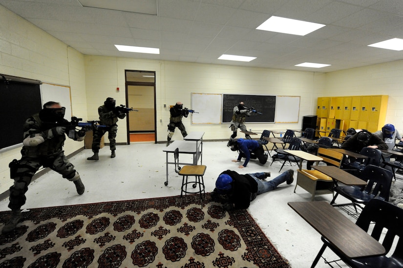 U.S. Air Force security forces members clear a room during a mock hostage exercise while participating with the Active Shooter Training Course in Mt. Pleasant, S.C., Feb. 23, 2010. The AST course prepares first responders on how to react to a hostile situation. (U.S. Air Force photo by James M. Bowman/released)


 