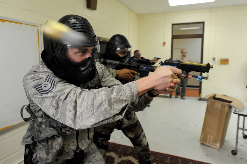 U.S. Air Force Tech. Sgt. Chris Stenke opens fire on a perpetrator during a clearing room exercise while participating in the Active Shooter Training Course at Mt. Pleasant, S.C., Feb. 23, 2010. The AST course prepares first responders on how to react to a hostile situation. Sergeant Stenke is the NCOIC of training with the  61st Security Forces Squadron at Los Angeles Air Force Base. (U.S. Air Force photo by James M. Bowman/released)

