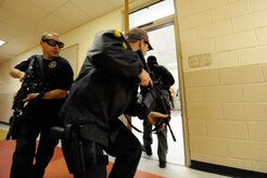 Dennis rushes into a room to clear the area during the Active Shooter Training Course at Mt. Pleasant, S.C., Feb. 23, 2010. The AST course prepares first responders on how to react to a hostile situation. Dennis is with the U.S. Marshals Service in Charleston, S.C. (U.S. Air Force photo by James M. Bowman/released)