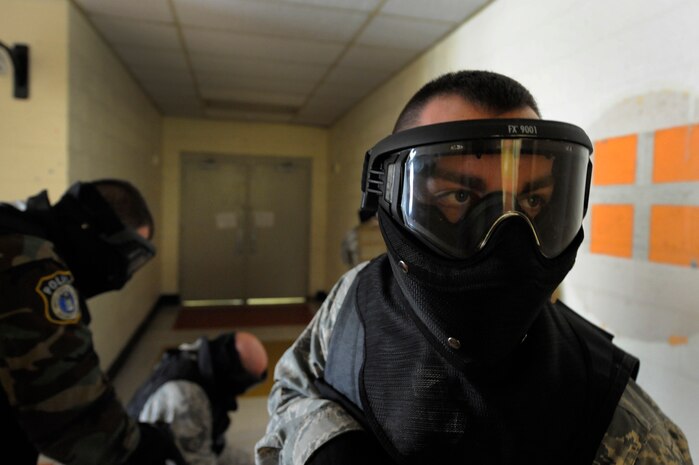 U.S. Air Force Staff Sgt. Brady Frazier provides rear cover during a hall clearing scenario during the Active Shooter Training Course at Mt. Pleasant, S.C., Feb. 23, 2010. The AST course prepares first responders on how to react to a hostile situation. (U.S. Air Force photo by James M. Bowman/released)


