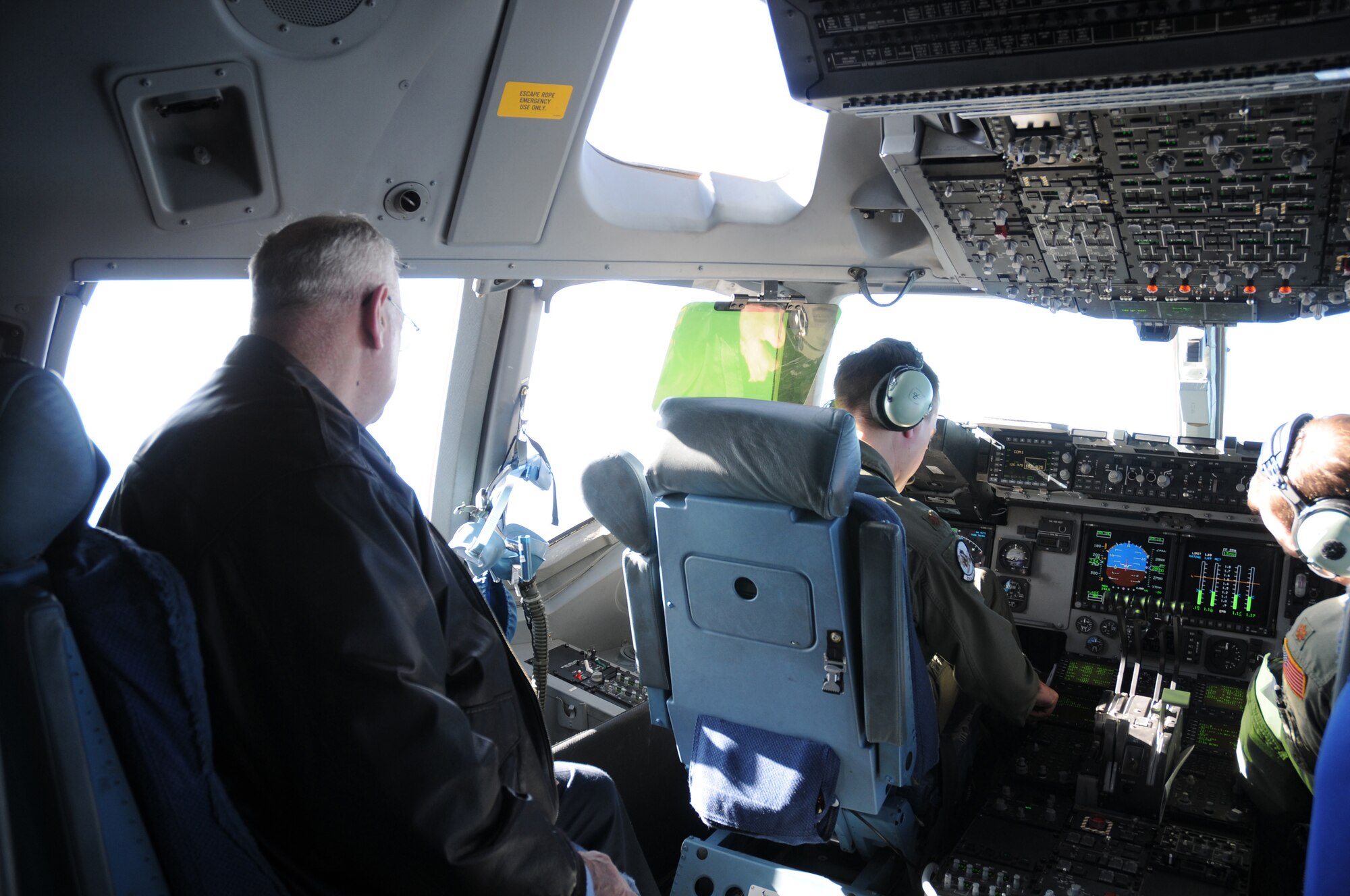 The Honorable Carleton Carey, mayor of Dover, observes the view from the flight deck of a C-17 Globemaster III as part of the 512th Airlift Wing's Civic Leader Tour Feb. 18-19 to Dobbins Air Reserve Base, Ga., and Keesler Air Force Base, Del. Mayor Carey had the opportunity to witness the aerial view of Dover during the return trip landing. (U.S. Air Force photo/Capt. Marnee A.C. Losurdo)