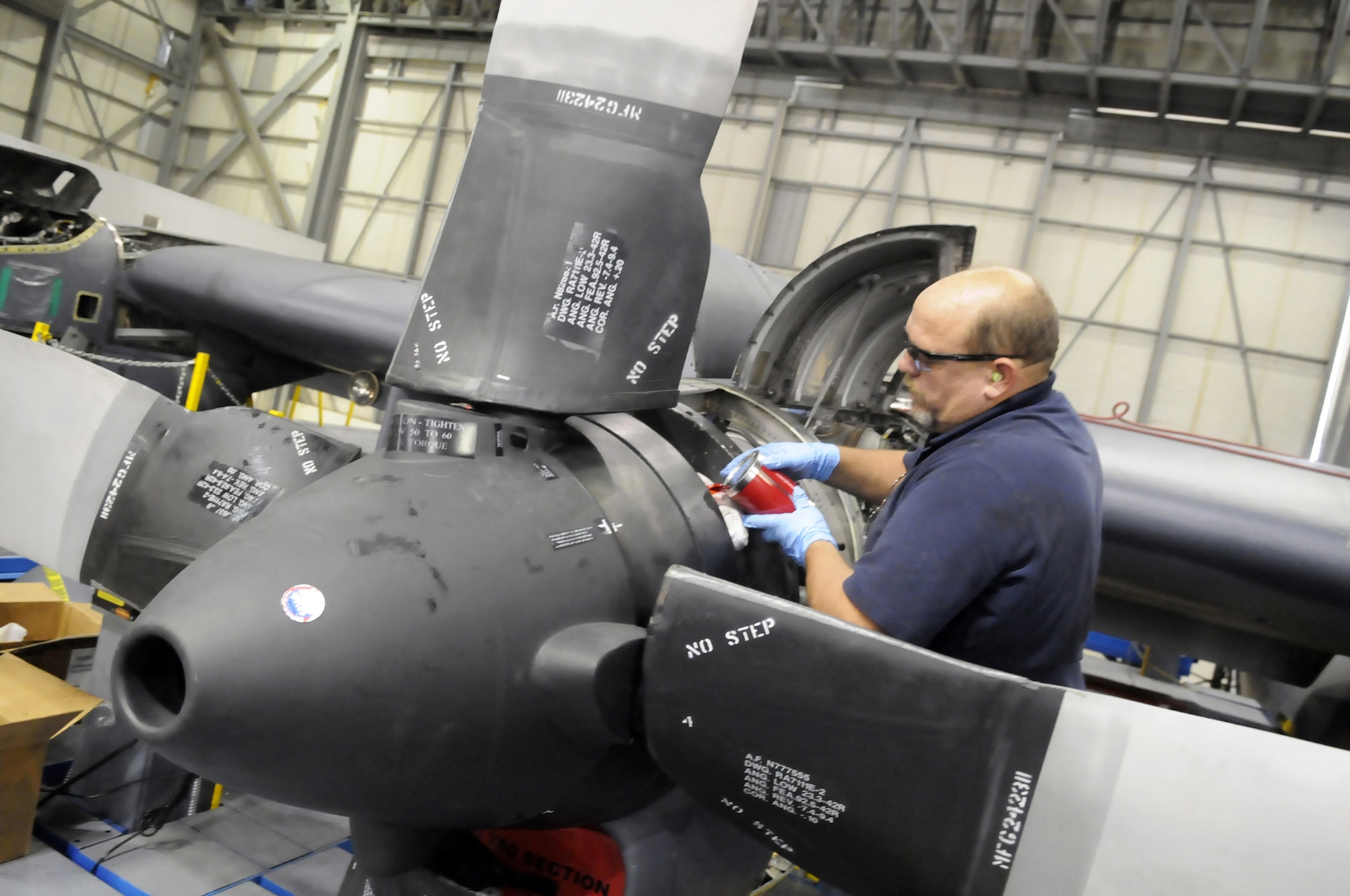 Steve Welchel works on one of the engines of a C-130. U. S. Air Force photo by Sue Sapp