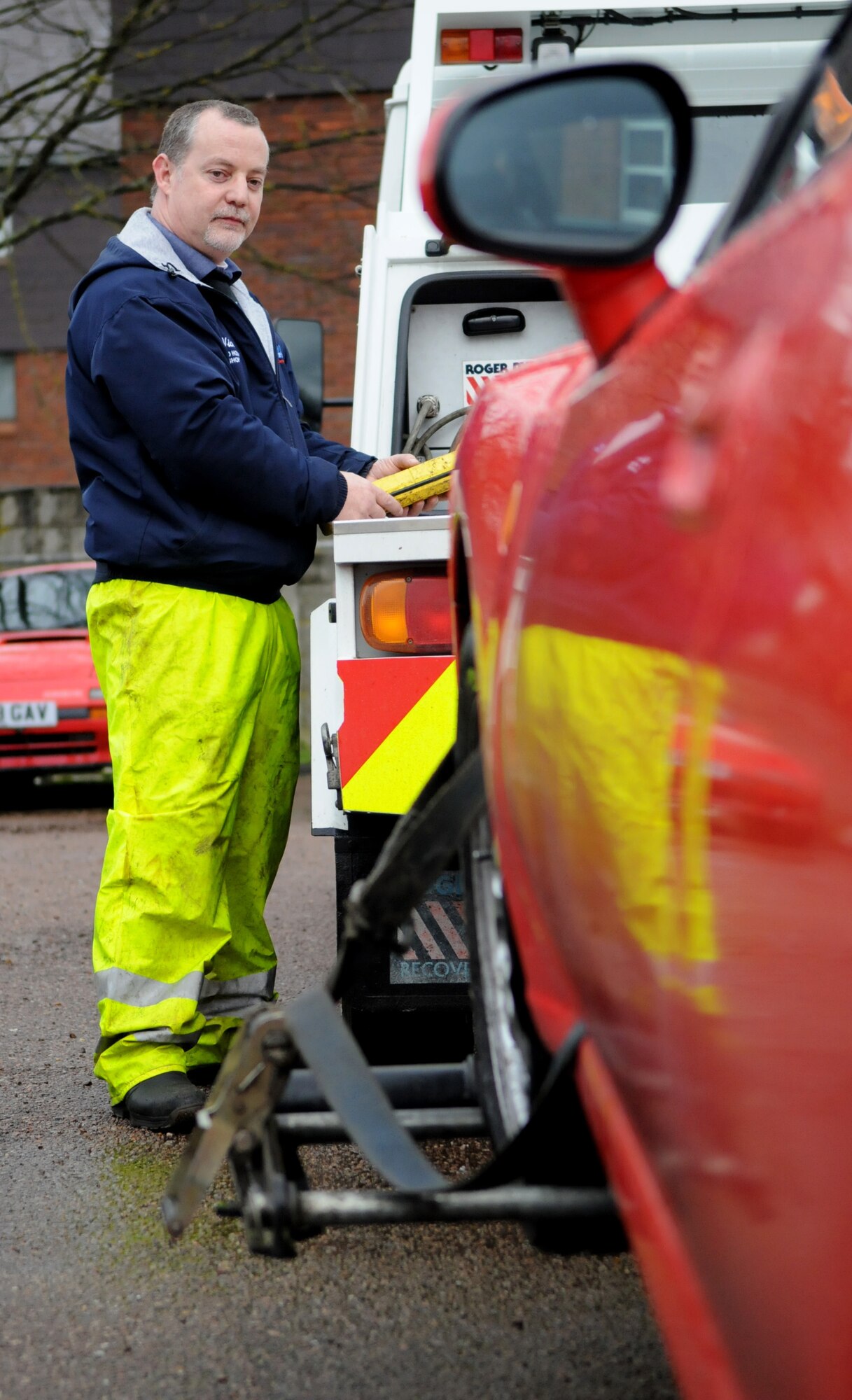 RAF MILDENHALL, England – Nick Turmaine, Auto Hobby Shop mechanic, raises a wrecked vehicle prior to towing Feb. 24, a service offered to RAF Mildenhall Airmen. For more information on prices and details call DSN 238-2480. (U.S. Air Force photo/ Staff Sgt. Jerry Fleshman) 