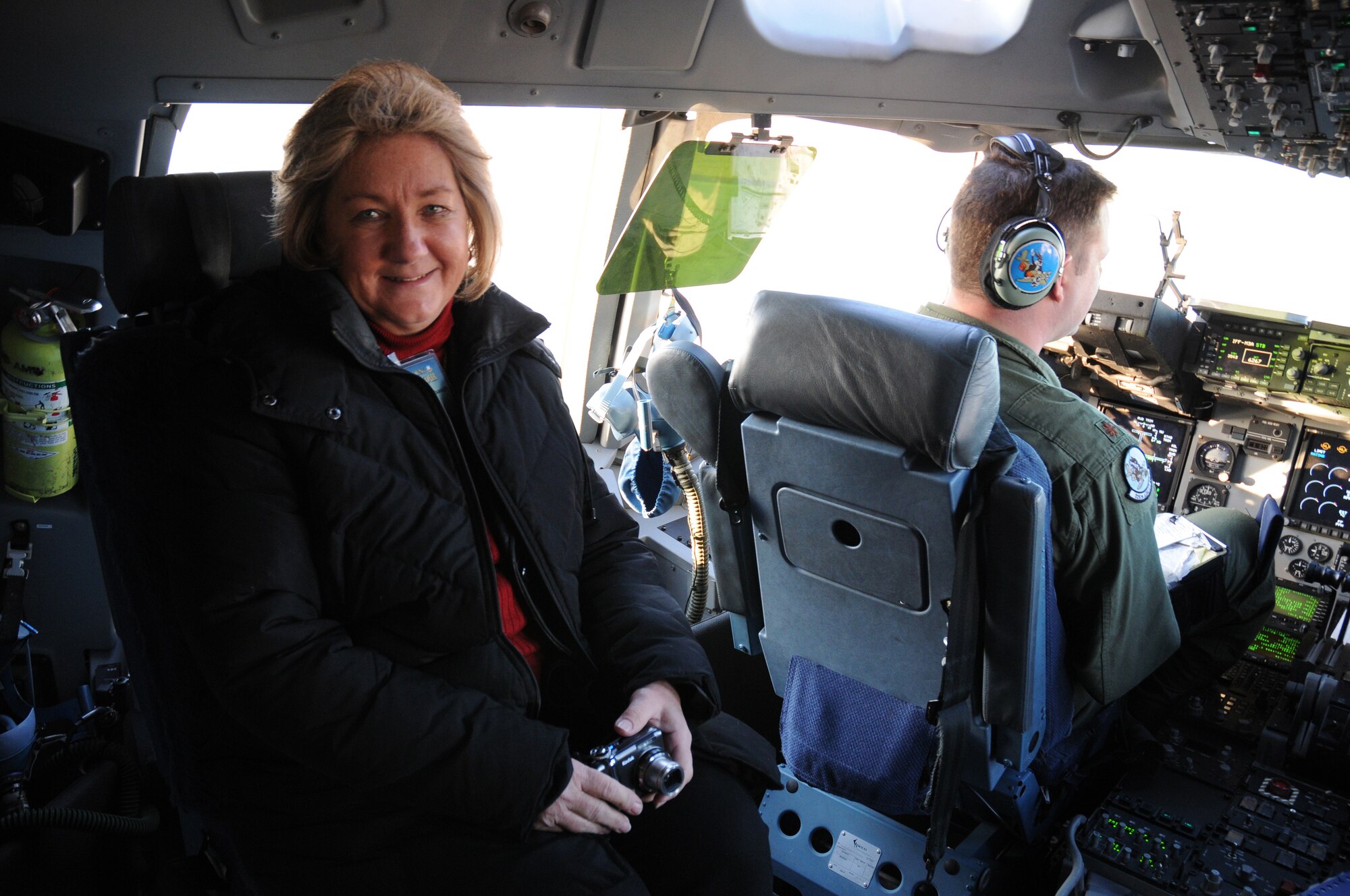 The Honorable Pat Stombaugh, mayor of Smyrna, experiences a ride in a C-17 Globemaster III on the flight deck as part of the 512th Airlift Wing's Civic Leader Tour Feb. 18-19 to Dobbins Air Reserve Base, Ga., and Keesler Air Force Base, Del. Mayor Stombaugh also had the opportunity to witness a mid-air refueling. (U.S. Air Force photo/Capt. Marnee A.C. Losurdo)