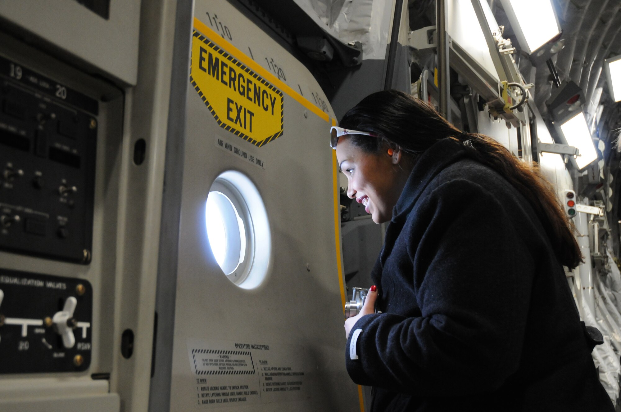 Crystal Officer, the executive director of ResCare-VOCA Delaware, takes in the view while aboard a C-17 Globemaster III flight to Dobbins Air Reserve Base, Ga. Ms. Officer is one of 19 civic leaders who participated in the 512th Airlift Wing's Civic Leader Tour, which also went to Keesler Air Force Base, Miss., where the group learned how reservists play a vital role in the nation's storm and hurricane weather analysis. (U.S. Air Force photo/Master Sgt. Veronica A. Aceveda)