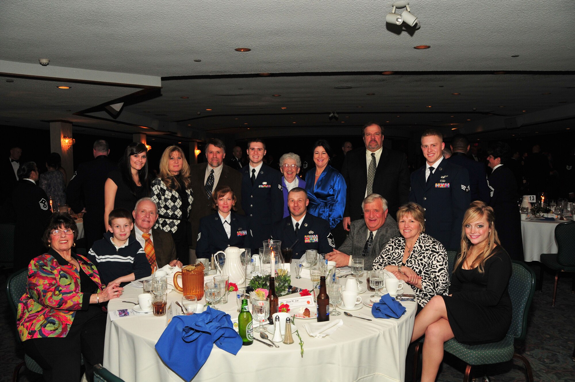 WRIGHT-PATTERSON AIR FORCE BASE, Ohio - The 445th Airlift Wing plays an important role in the life of this family.  Tech. Sgt. Claire McDonald (front row) is a former member of the wing and is married to Master Sgt. Bob McDonald (front row), a recruiter in the 445th Recruiting Squadron.  Master Sgt. McDonald played a key role in bringing Senior Airman Matt McDonald (back row, fourth from left), Senior Airmen Matthew Cook (back row, right), and Airman 1st Class Gabriel Page (not pictured) into the 445th Airlift Wing.  All three are currently traditional reservists in the unit. (U.S. Air Force photo/Mr. Bill Richard)