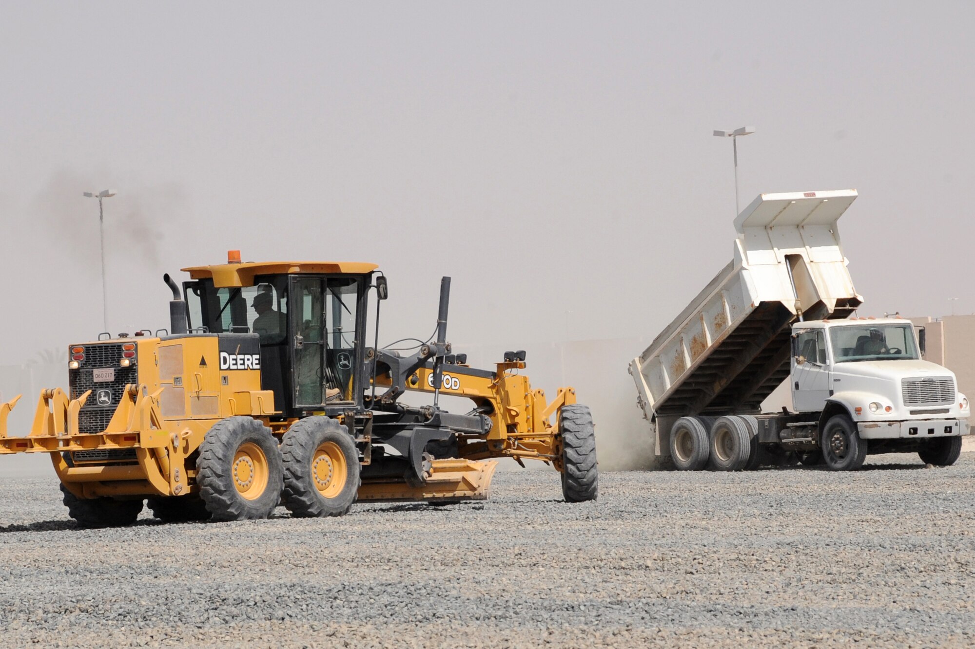 Members of the 380th Expeditionary Civil Engineer Squadron perform maintenance on a parking lot at an undisclosed location in Southwest Asia Feb. 24, 2010. (U.S. Air Force Photo/Senior Airman Jenifer H. Calhoun/Released)
