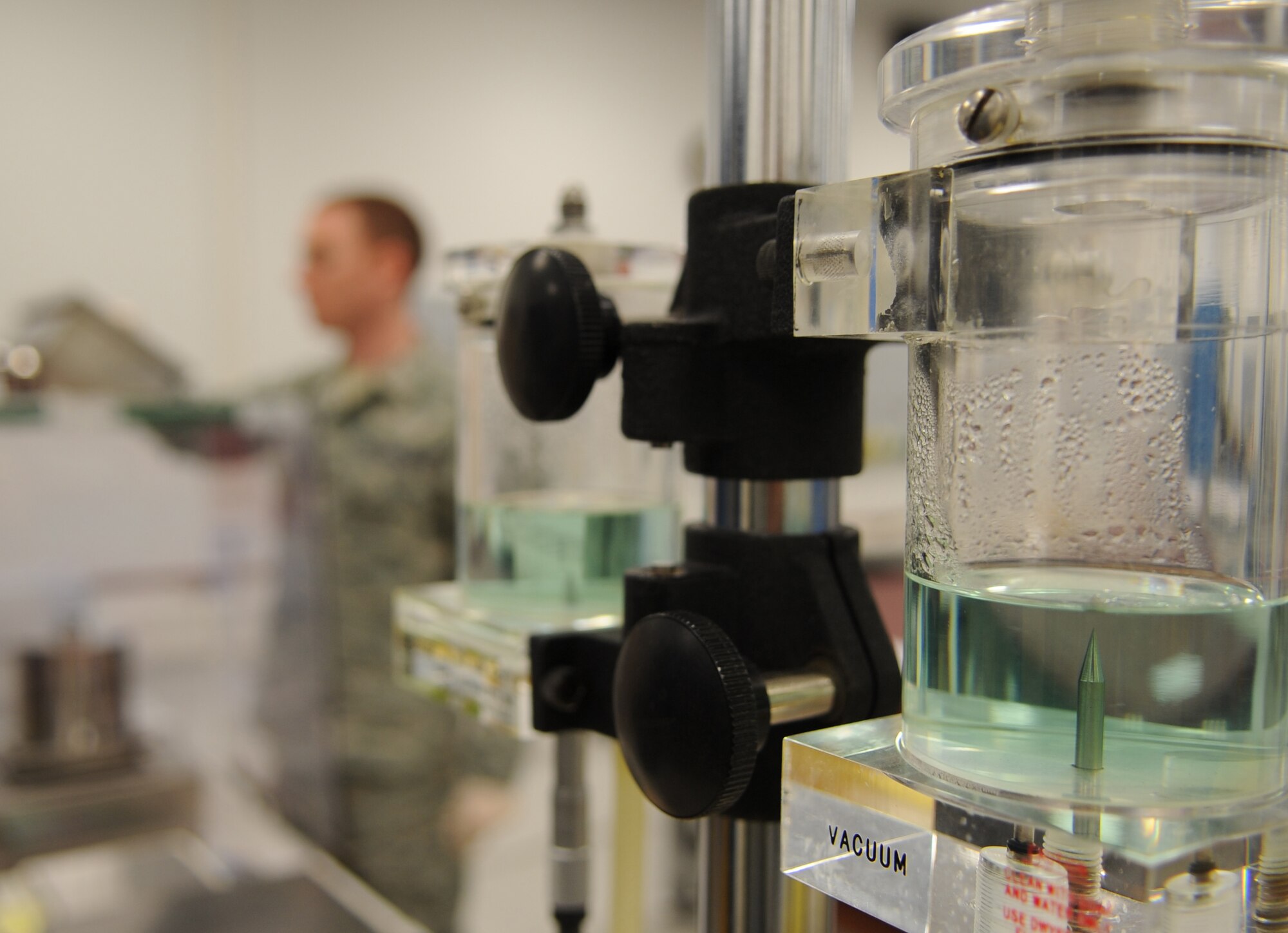 U.S. Air Force Senior Airmen Justin Theis, 86th Maintenance Squadron Test Measurement and Diagnostic flight technician, checks the calibration of a scale using a precise weight, Ramstein Air Base, Germany, Feb. 23, 2010.  The flight consists of a Scheduling Section, Shipping/Receiving section, Admin Section and the Precision Measurement Equipment Laboratory (PMEL) and services customers throughout United States Air Forces in Europe, United States Central Command, and United States Africa Command. (U.S. Air Force photo by Airman 1st Class Caleb Pierce)