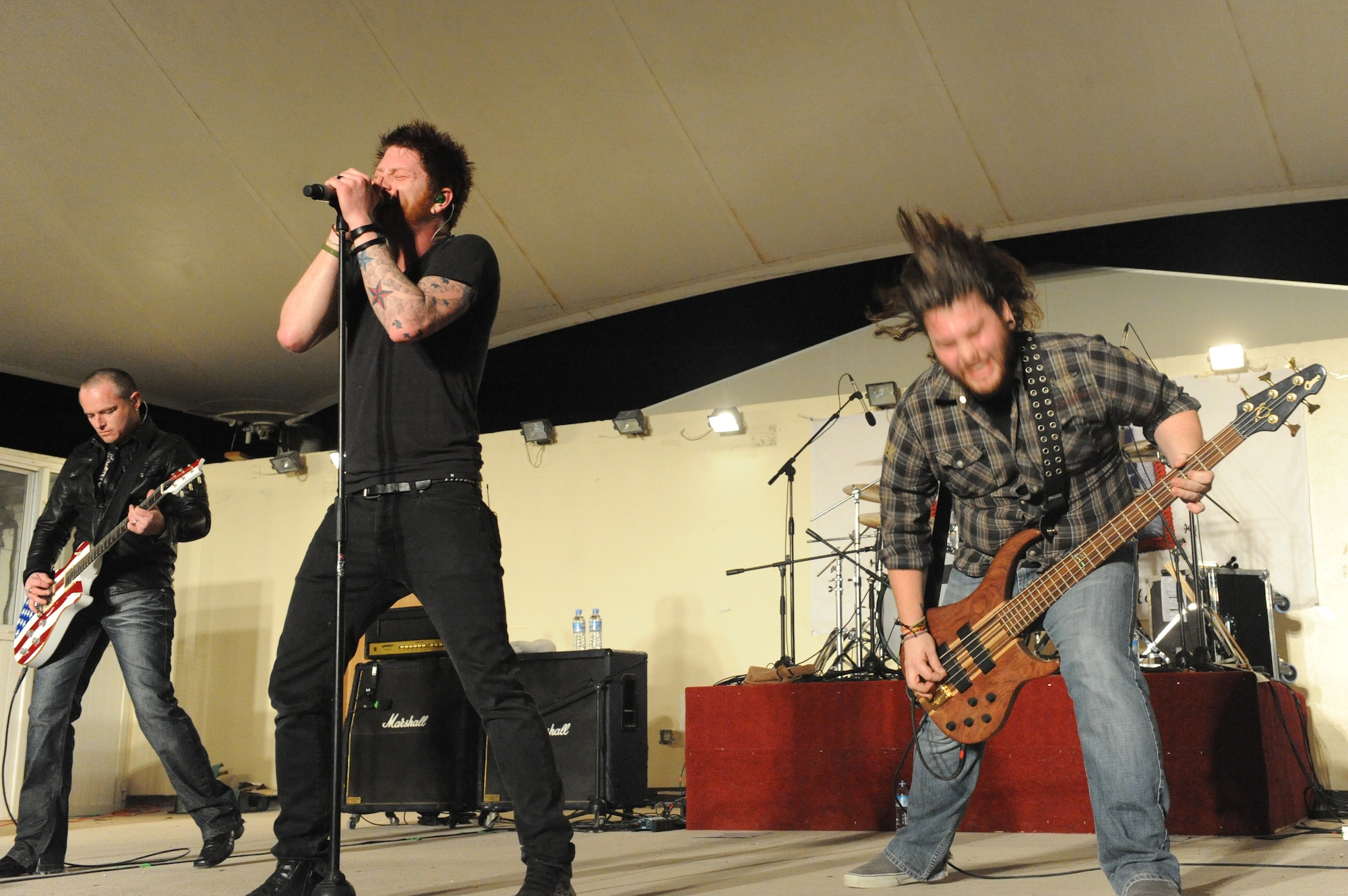 Lead vocalist Jared Weeks, lead guitarist Jason Null and bass guitarist Eric Taylor of national recording artists Saving Abel perform for servicemembers at a non-disclosed Southwest Asia location, Feb. 22, 2010. (U.S. Air Force photo by Tech. Sgt. Michelle Larche)[RELEASED]