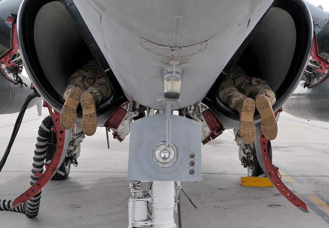 NELLIS AIR FORCE BASE, Nev. -- Naval aircraft maintainers from Electronic Attack Squadron 209, Andrews AFB, Washington, D.C. inspect the engine fan blades in the inlet of an EA-6B Prowler during a preflight inspection at Red Flag 10-3 Feb. 24. Sailors assigned to the Prowler are deployed to Red Flag from VAQ-209 and Naval Air Station Whidbey Island, Wash. (U.S. Air Force photo by Tech. Sgt. Chris Flahive)
