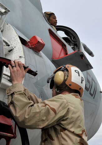 NELLIS AIR FORCE BASE, Nev. -- Petty Officer 3rd Class Richard Vanschaik and Seaman Apprentice Kandice Jones, Electronic Attack Squadron 209, Andrews AFB, Washington, D.C., conduct refueling operations on an EA-6B Prowler during a preflight at Red Flag 10-3, the Air Force's premier aerial combat exercise, Feb. 24. The Prowler is a long-range, all-weather aircraft with advanced electronic countermeasures capability. (U.S. Air Force photo by Tech. Sgt. Chris Flahive)