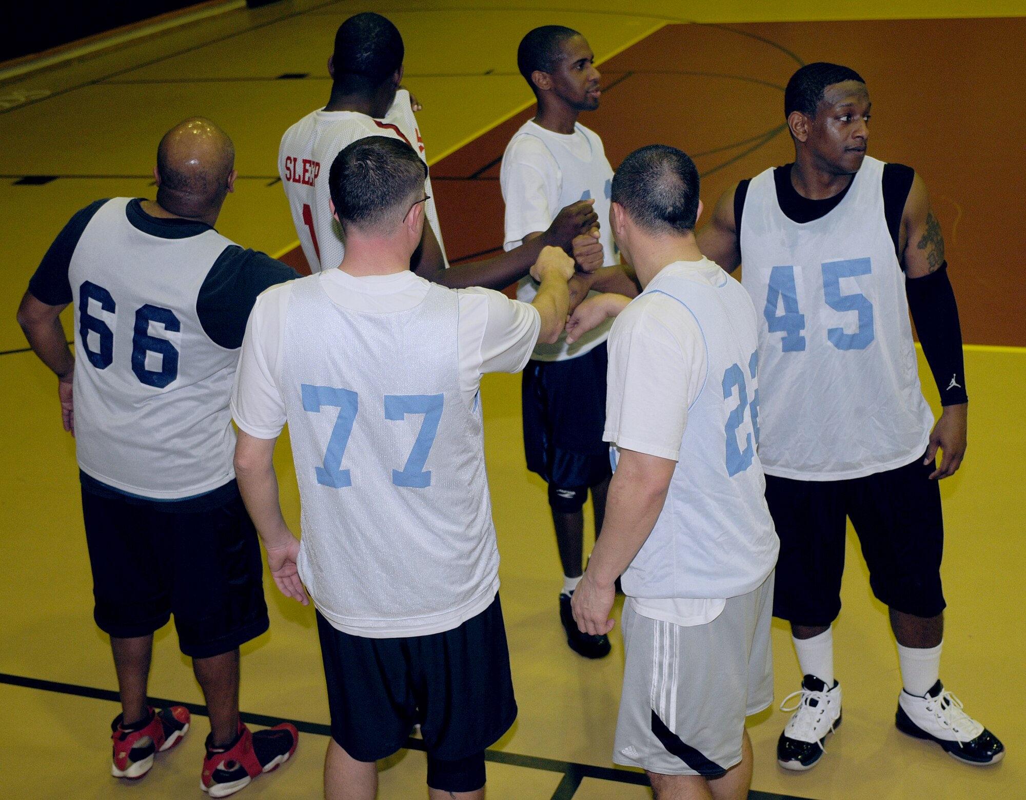 Members of the 39th Logistics Readiness Squadron over 30 team break out of a halftime meeting during an intramural basketball game Monday, Feb. 22 at Incirlik Air Base, Turkey.  The 39th LRS over 30 team was the champion of the over 30 season, and defeated the 728th AMS over 30 team 61-46 in the championship game Feb. 23. (U.S. Air Force photo/Senior Airman Alex Martinez)