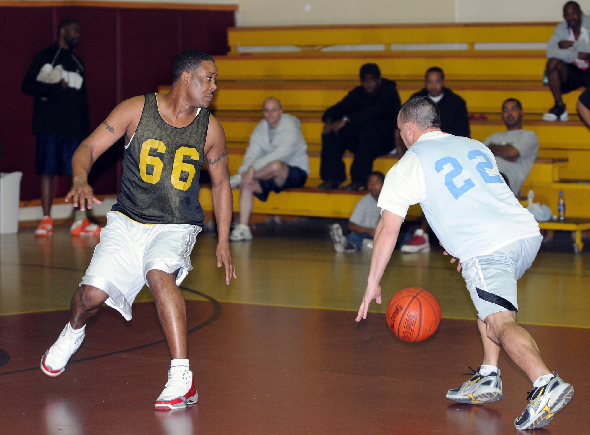 Tech. Sgt. Robert Wilson, 39th Logistics Readiness Squadron, jukes Master Sgt. Spencer Carter, 728th Air Mobility Squadron, during an intramural basketball game Monday, Feb. 22 at Incirlik Air Base, Turkey.  The 39th LRS over 30 team was the champion of the over 30 season, and defeated the 728th AMS over 30 team 61-46 in the championship game Feb. 23. (U.S. Air Force photo/Senior Airman Alex Martinez)
