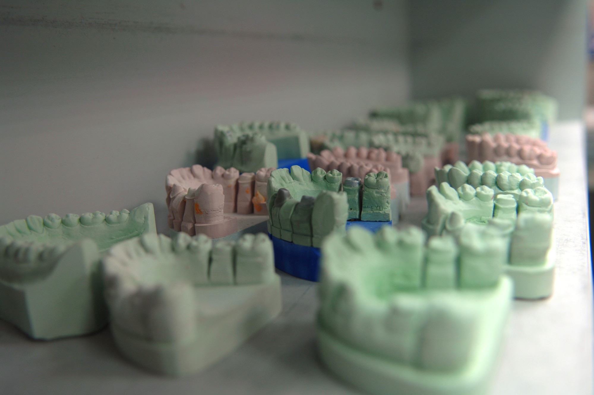Denture molds sit on a shelf at the Sembach Area Dental Laboratory, Sembach Annex, Germany. Sembach ADL personnel who work at Building 151 on Sembach Annex will accept control of their new facility Building 301A behind the dental clinic located on Ramstein Air Base, Germany. (U.S. Air Force photo by Tech. Sgt. Michael Voss)