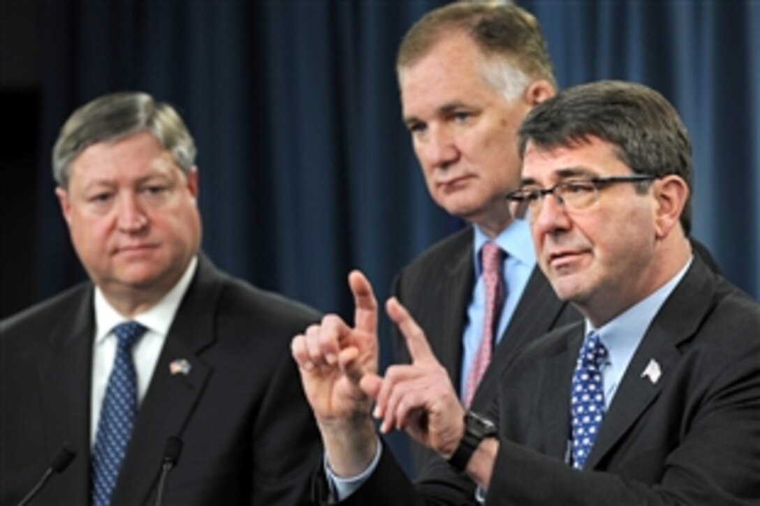 Deputy Secretary of Defense William J. Lynn III, center, Air Force Secretary Michael Donley, left, and Ashton Carter, undersecretary of Defense for acquisition, technology and logistics, right, hold a press conference at the Pentagon, Feb. 24, 2010, to announce that the U.S. Air Force has issued a formal Request For Proposal for the KC-X next-generation aerial tanker.