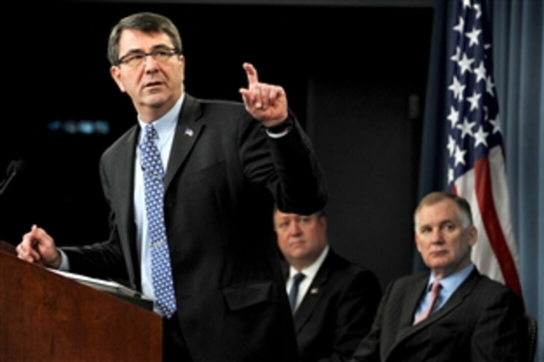 Ashton Carter, undersecretary of Defense for acquisition, technology and logistics, briefs reporters at the Pentagon, Feb. 24, 2010, on the details of the selection process for the contract to build the next-generation aerial refueling tanker aircraft for the U.S. Air Force. Carter was joined at the press conference by Deputy Secretary of Defense William J. Lynn III, right, and Air Force Secretary Michael Donley, center.