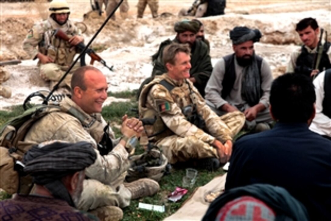 U.S. Marine Corps Capt. Stephan P. Karabin II, left, meets with British soldiers, Afghan leaders and Afghan National Policemen near Marja, Afghanistan, Feb. 21, 2010. Karabin is assigned to Charlie Company, 1st Battalion, 3rd Marine Regiment.