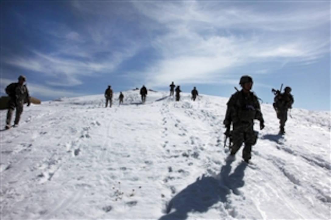 U.S. Army soldiers walk down a steep, snowy, slope as part of a foot patrol in Sayed Abad district, Wardak province, Afghanistan, Feb. 19, 2010. Foot patrols are often used to talk to and check on the welfare of Afghan residents. The soldiers are assigned to Company A, 1st Battalion, 503rd Infantry Regiment, 173rd Airborne Brigade Combat Team. 