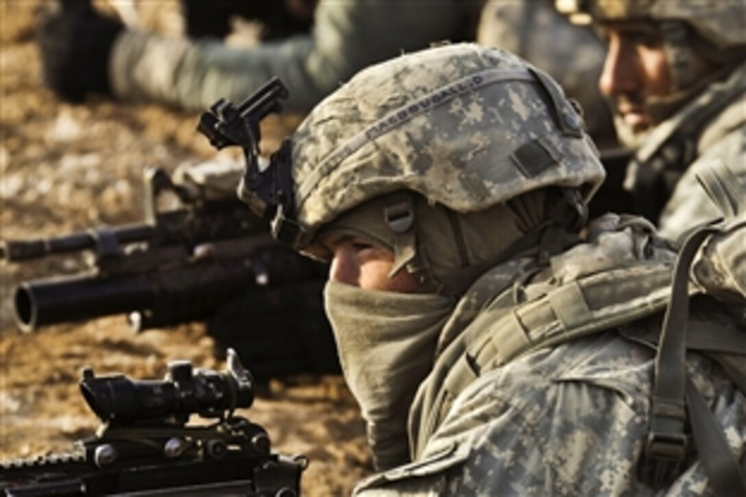 U.S. soldiers provide security and search for improvised explosive devices during Operation Helmand Spider in Badula Qulp in Afghanistan's Helmand province, Feb. 23, 2010.  The soldiers are assigned to Company A, 1st Battalion, 17th Infantry Regiment.
