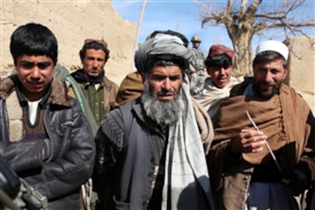 Afghans talk to a patrol of U.S. Army soldiers in the village of Bar Mamel in Afghanistan's Wardak province, Feb. 19, 2010. The soldiers, assigned to the 173rd Airborne Brigade Combat Team, engage Afghan residents to assess conditions in the village and build relationships.