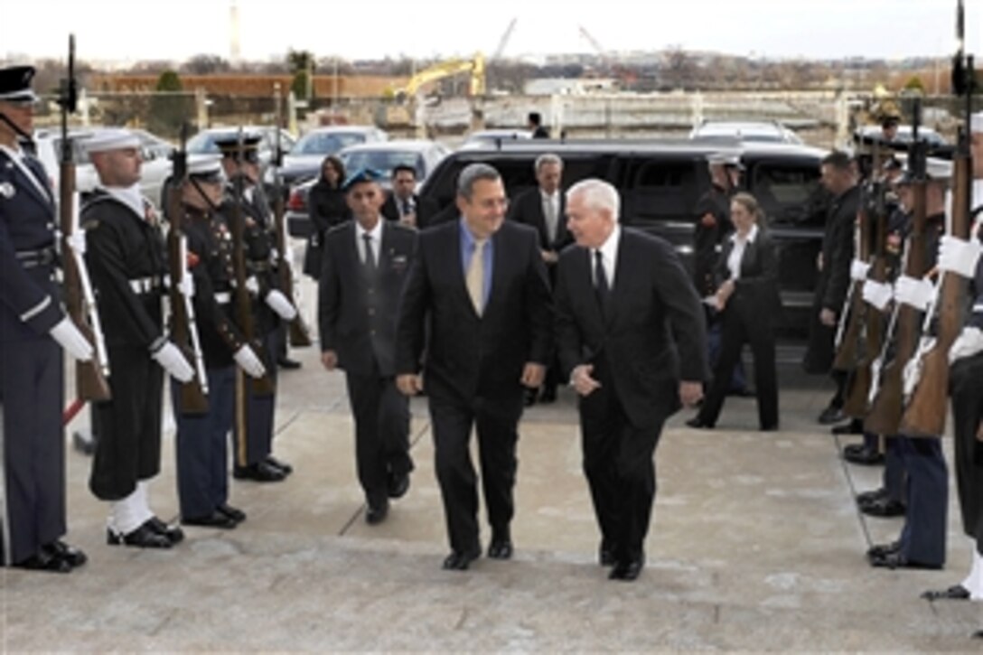 Defense Secretary Robert M. Gates, right, escorts visting Israeli Minister of Defense Ehud Barak through an honor cordon into the Pentagon, Feb. 25, 2010. 