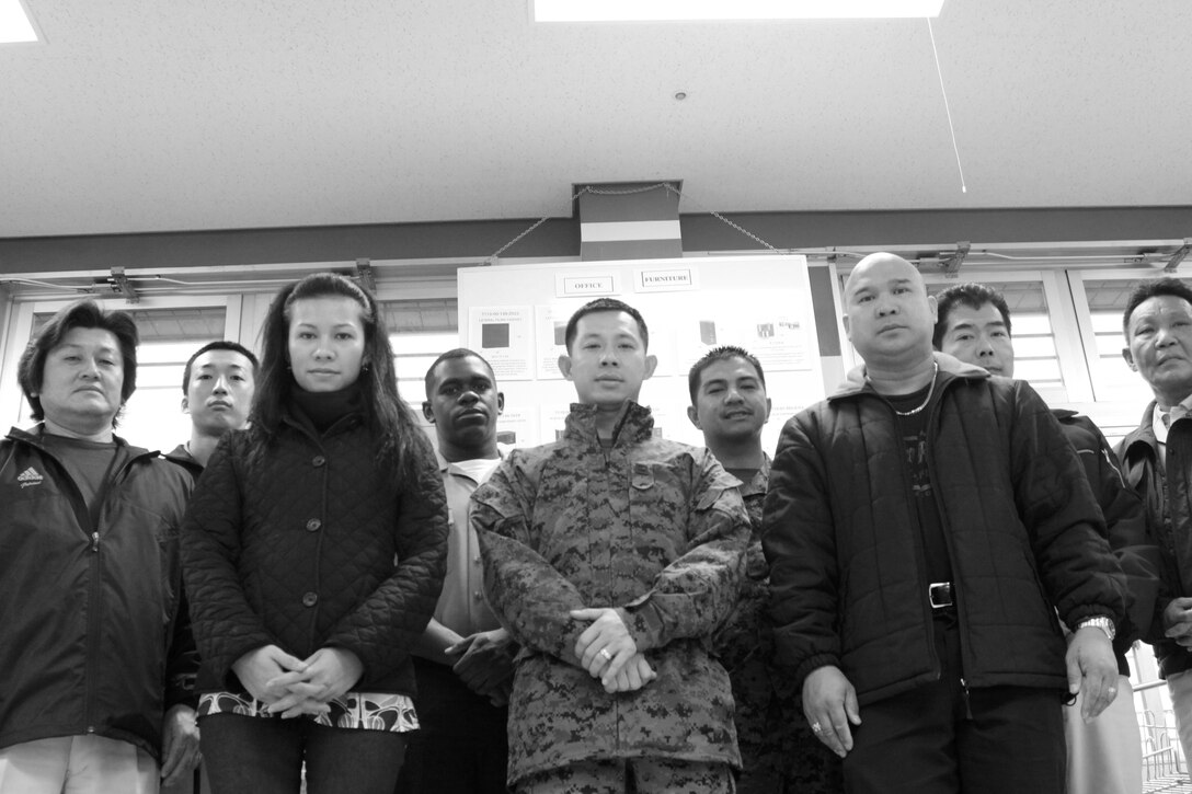 The Servmart staff poses for a group photo at the United States Marine Corps Sermart here Feb. 26. The store reached its one year anniversary Feb. 18.