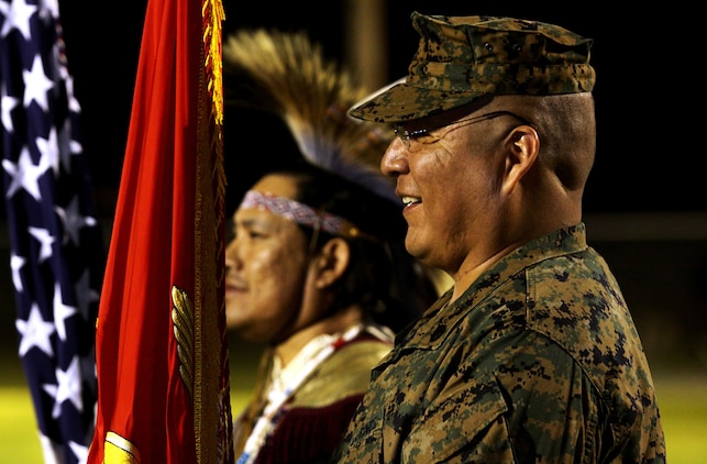 Staff Sgt. James L. Eagleman, former 1st Marine Division tanker and current resident at Wounded Warrior Battalion West, bears the Corps colors during “Operation One Drum’s” closing ceremony at Camp Pendleton, Feb. 25. American Indians from across the nation embraced nearly 30 combat veterans during a four-day workshop designed to alleviate combat stress.