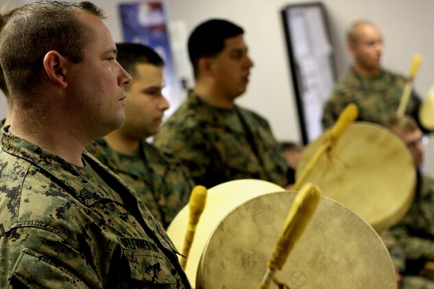 Sgt. Brandon W. Delfiorentino, resident, Wounded Warrior Battalion West, plays a hand-made drum he put together during “Operation One Drum’s” closing ceremony at Camp Pendleton, Feb. 25. American Indians from across the nation embraced nearly 30 combat veterans during a four-day workshop designed to alleviate combat stress.
