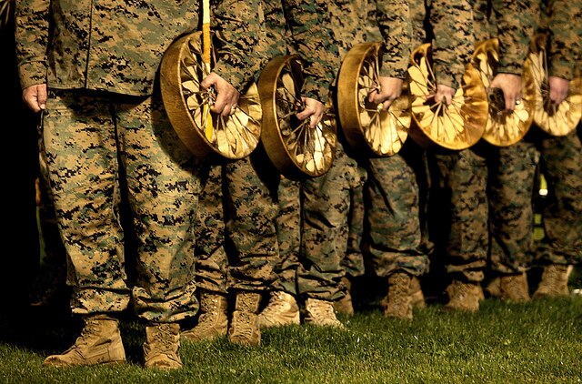 West Coast wounded warriors hold hand-made tribal drums during “Operation One Drum’s” closing ceremony at Camp Pendleton, Feb. 25. American Indians from across the nation embraced nearly 30 combat veterans during a four-day workshop designed to alleviate combat stress.