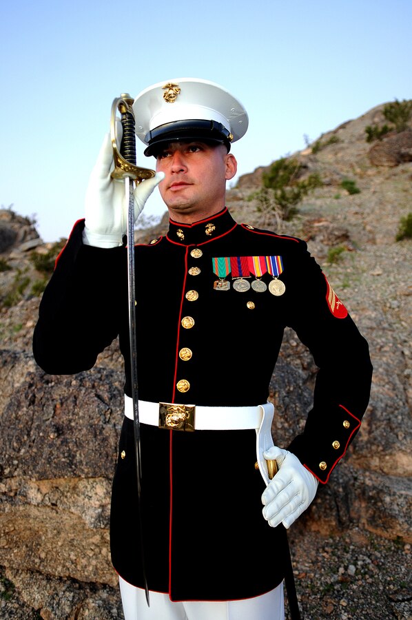 Cpl. Robert Dominguez, a 26-year-old native of Selma, Calif., serves as the Silent Drill Platoon’s latest drill master, tasked with memorizing, teaching and passing down the platoon’s unique drill manual, called slide drill. In addition to teaching and critiquing the platoon’s drill, Dominguez is also responsible for creating a new drill sequence for the platoon to perform and for selecting the year’s new members and the 24 Marines who will drill during performances. The position of drill master is passed down each year, just as the drill sequence changes each year. Dominguez, who is in his third year with the platoon, is the platoon’s 62nd drill master. “It’s a great honor to be the 62nd drill master of the Marine Corps Silent Drill Platoon, teaching the manual to Marines and passing it on,” said Dominguez, who became the drill master Nov. 4, 2009. “I am the keeper of the Silent Drill Platoon’s traditions.”