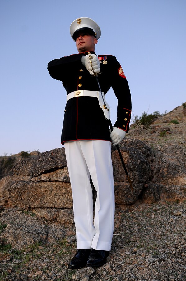 Cpl. Robert Dominguez, a 26-year-old native of Selma, Calif., serves as the Silent Drill Platoon’s latest drill master, tasked with memorizing, teaching and passing down the platoon’s unique drill manual, called slide drill. In addition to teaching and critiquing the platoon’s drill, Dominguez is also responsible for creating a new drill sequence for the platoon to perform and for selecting the year’s new members and the 24 Marines who will drill during performances. The position of drill master is passed down each year, just as the drill sequence changes each year. Dominguez, who is in his third year with the platoon, is the platoon’s 62nd drill master. “It’s a great honor to be the 62nd drill master of the Marine Corps Silent Drill Platoon, teaching the manual to Marines and passing it on,” said Dominguez, who became the drill master Nov. 4, 2009. “I am the keeper of the Silent Drill Platoon’s traditions.”