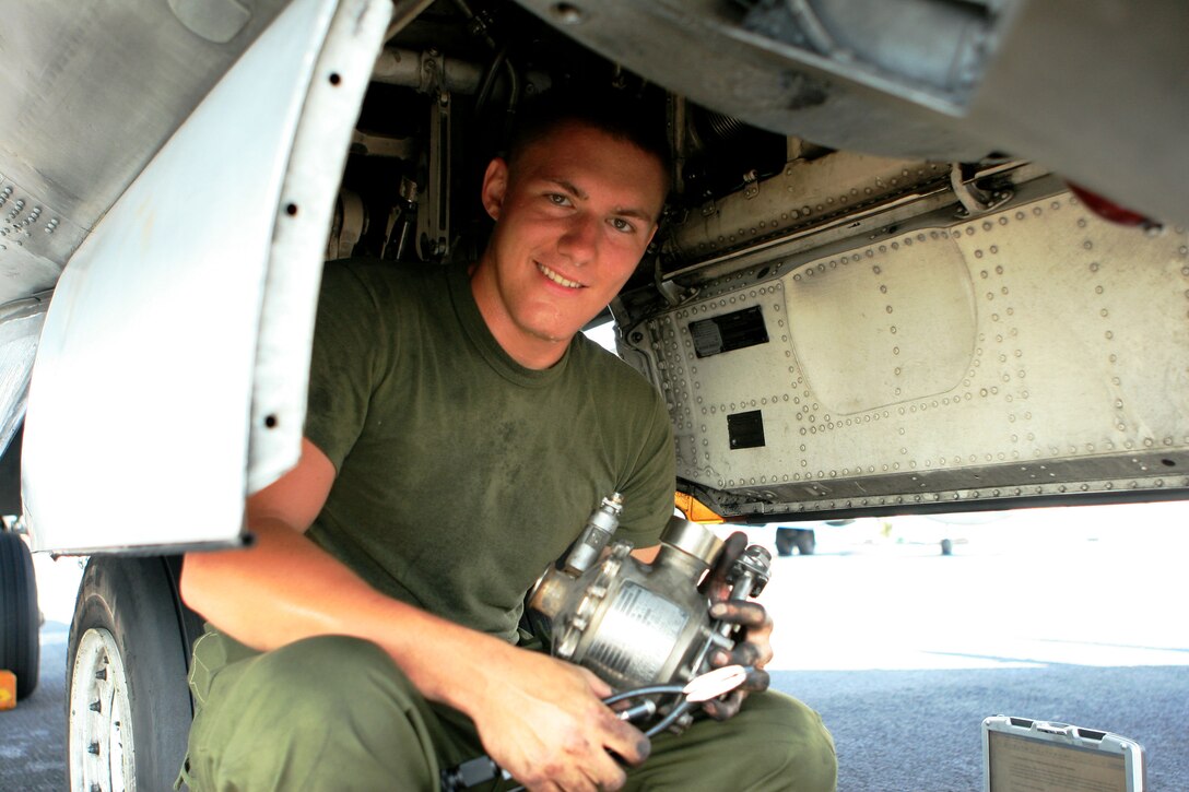 Cpl. Aaron Neal, a Milwaukee native and an AV-8B II Harrier power line mechanic with Marine Attack Squadron 311 (VMA-311), 31st Marine Expeditionary Unit (MEU), removes a water pump during a scheduled maintenance aboard the forward-deployed amphibious assault ship USS Essex (LHD-2), Feb. 26. VMA-311 is the fixed-wing attack component of the Aviation Command Element (ACE) attached to the MEU. The MEU recently completed Exercise Cobra Gold 2010 (CG ’10) and is currently scheduled to go underway to the Republic of the Philippines in support of Exercise Balikatan 2010 (BK ’10).