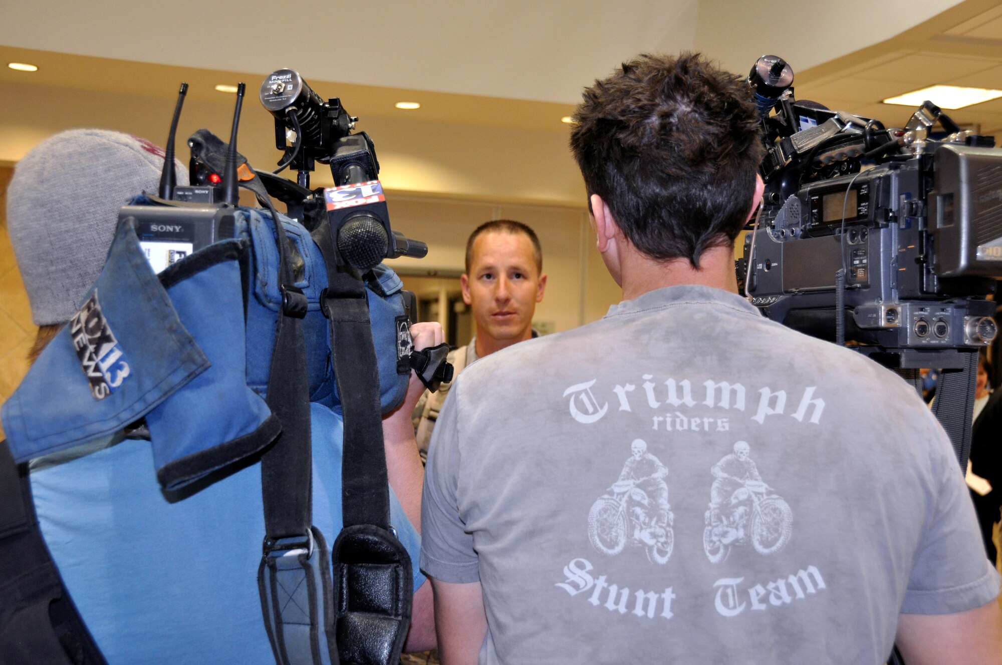 Tech. Sgt. Justin Adams, 67th Aerial Port Squadron, shares his recent experiences in Haiti with local news media upon arrival at the Salt Lake City International Airport Feb. 26. (U.S. Air Force photo/Bryan Magaña)