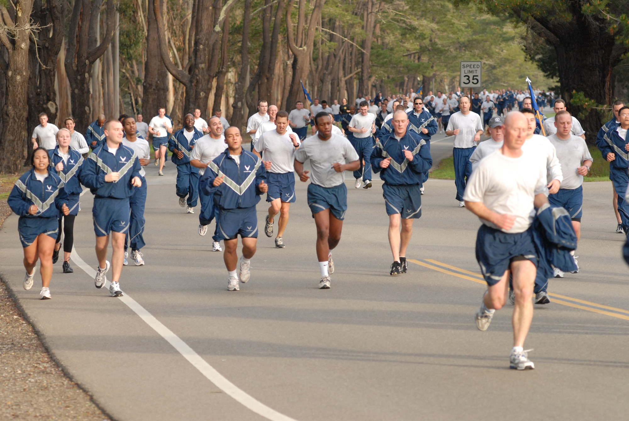VANDENBERG AIR FORCE BASE, Calif. -- Following closely behind the individual runners, multiple formations pull up the rear during Vandenberg’s Fit-to-Fight Run held here Friday, Feb. 26, 2010. The run is Vandenberg’s way of holding its Airmen to a higher standard of physical fitness each month. (U.S. Air Force photo/Airman 1st Class Angelina Drake)
