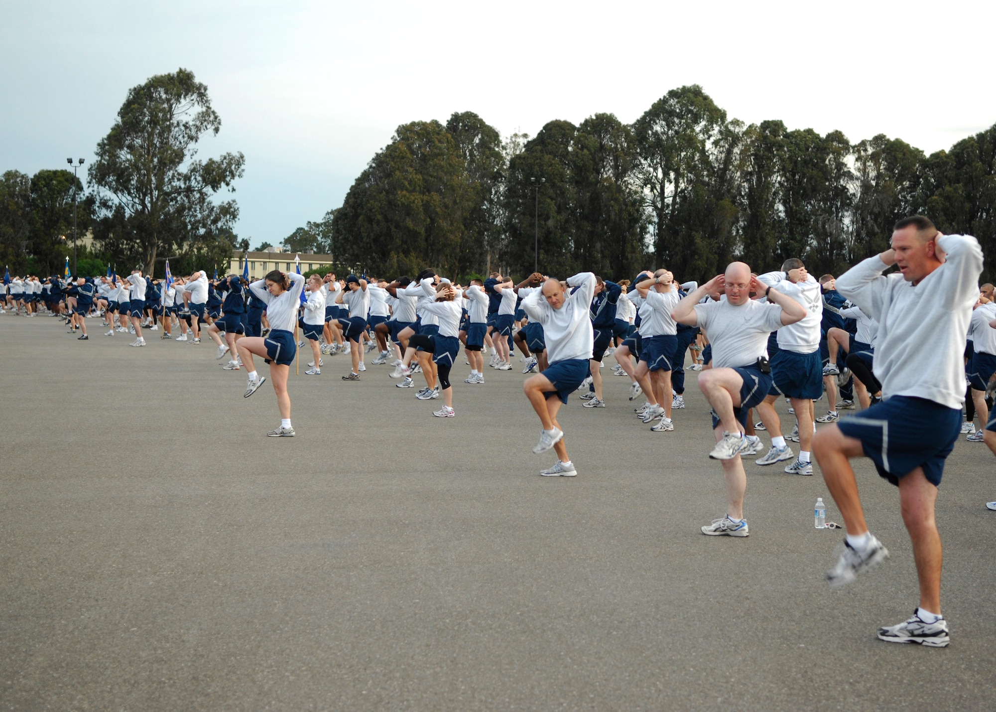 VANDENBERG AIR FORCE BASE, Calif. --Twisting and stretching their bodies, Airmen of the 30th Space Wing prepare for the monthly Fit-to-Fight Run here Feb. 26, 2010. The wing run emphasizes Vandenberg’s commitment to the “Fit to Fight” motto.(U.S. Air Force photo/Airman 1st Class Heather Shaw)