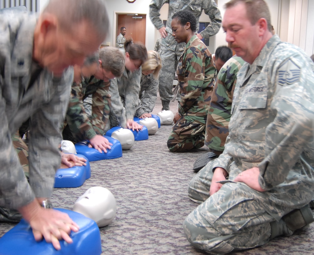 932nd Medical Group members got additional Cardiopulmonary Resuscitation (CPR) training and practice during a recent unit training assembly drill at Scott Air Force Base.  Courses like self-aid and buddy care help them survive alone, or take care of others injured during deployment, and also be prepared to take care of someone in the community like friends and family.  (U.S. Air Force photo/Maj. Stan Paregien)