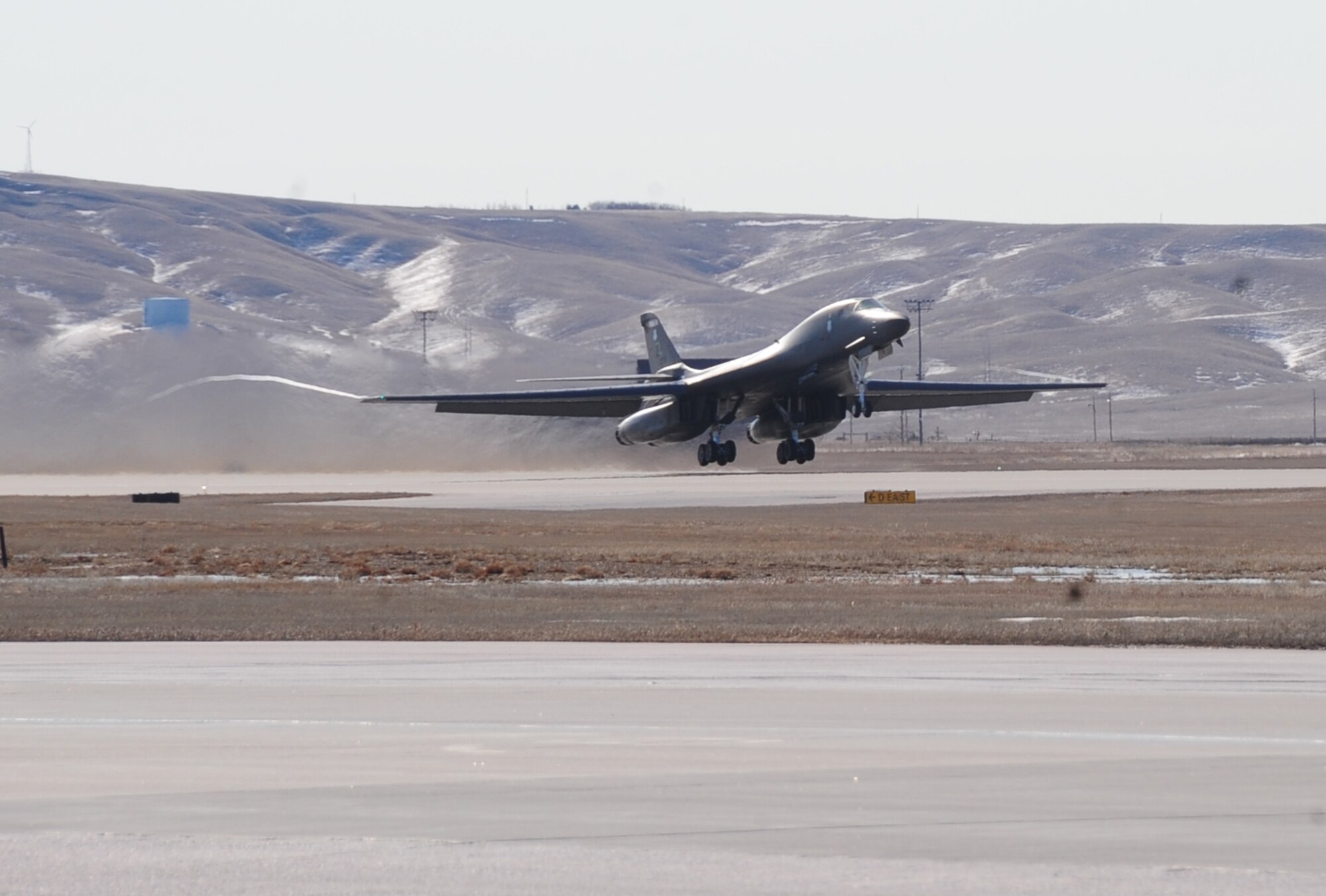 ELLSWORTH AIR FORCE BASE, S.D. -- A B-1B Lancer from the 34th Bomb Squadron takes off carrying Col. Kory Cornum, Air Combat Command's command surgeon, Feb. 26.  Col. Cornum visited Ellsworth to recognize 28th Medical Group personnel for outstanding performance. (U.S. Air Force photo/Airman 1st Class Anthony Sanchelli)