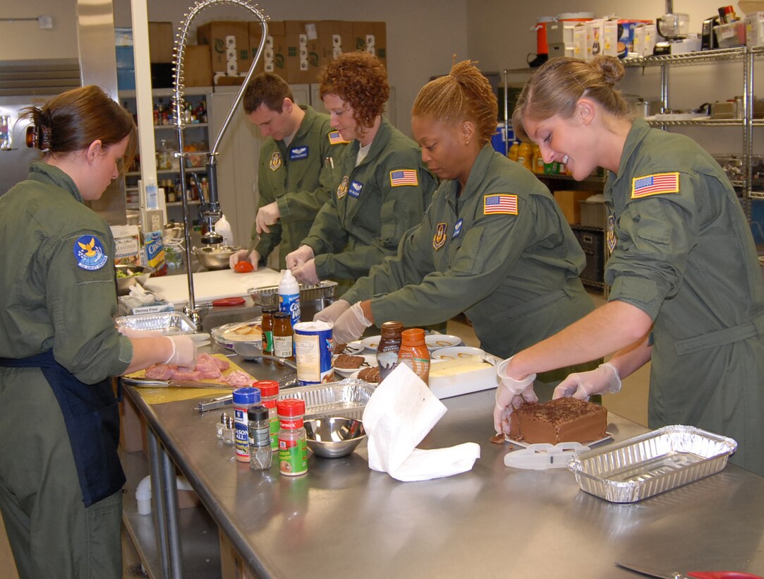 932nd Airlift Wing Flight attendants prepare meals inside the flight kitchen in advance of a future mission   They must plan ahead and take enough food to sometimes cover 10 days of travel.  There are positions still open for those interested in the Air Force Reserve Command flight attendant program and more information is available at 1-800-257-1212. (U.S. Air Force photo/Maj. Stan Paregien)