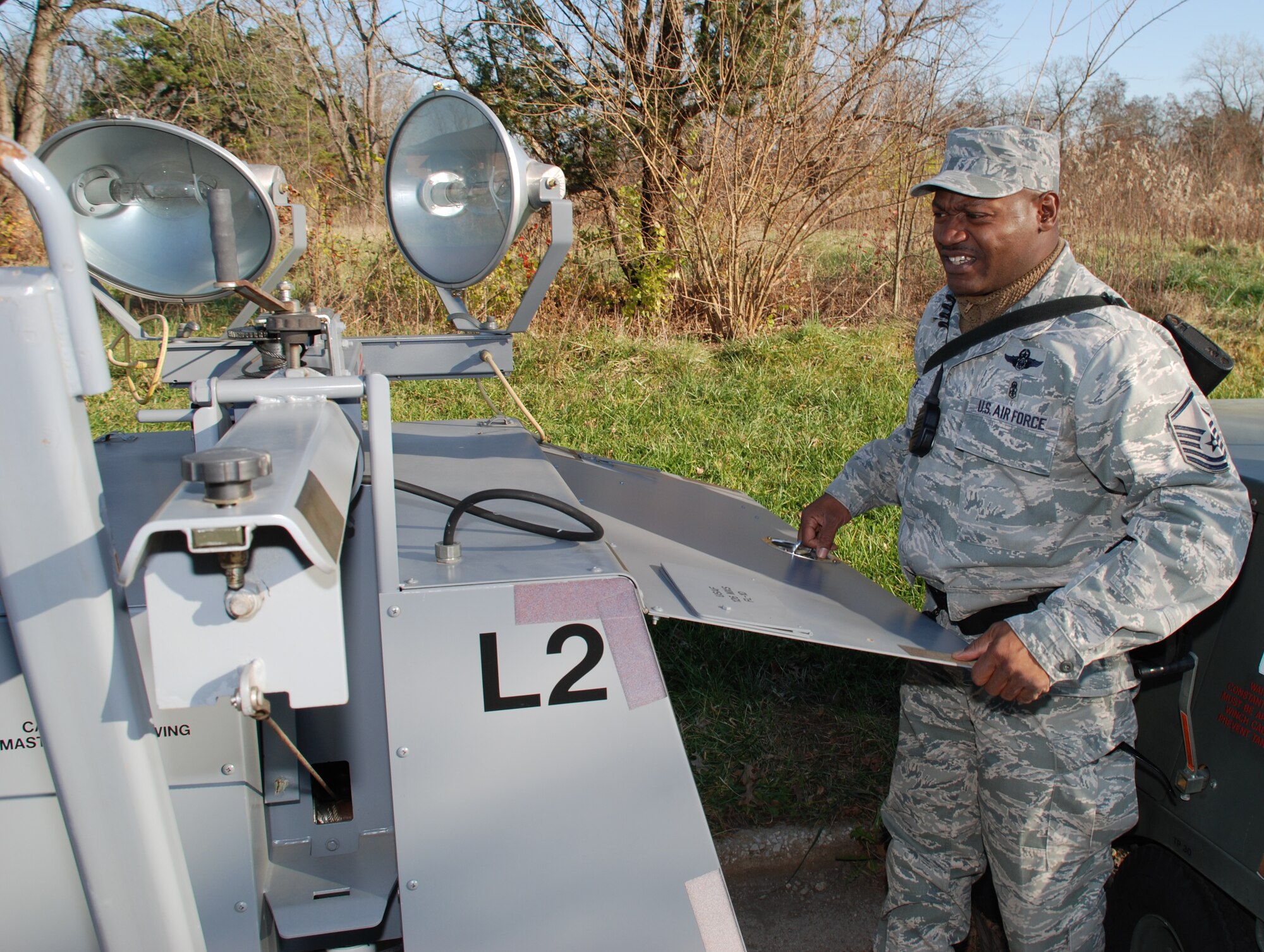 Master Sgt. Rico Walker checks a generator near the 932nd Airlift Wing, an Air Force Reserve Command unit in Illinois.  (U.S. Air Force photo/Maj. Stan Paregien)